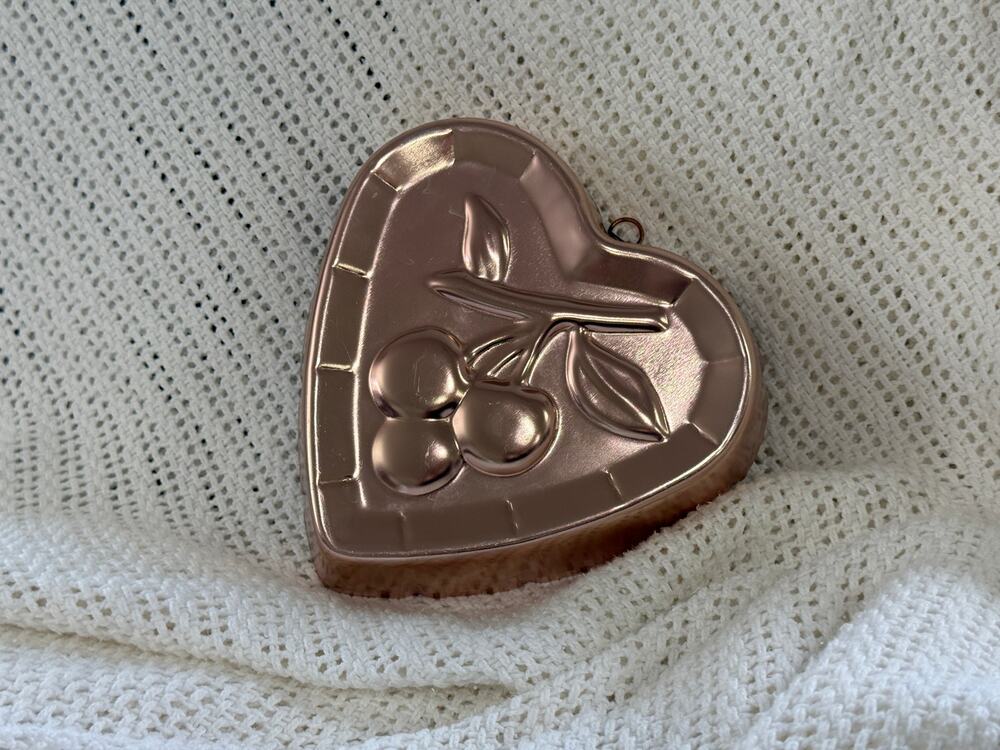 Vintage West Bend heart-shaped jello mold with cherry design